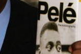LONDON - MAY 18:  Brazilian football hero Pele holds copies of his autobiography at a book launch at the Virgin Megastore Picadilly on May 18, 2006 in London, England. The man they also call Edson Arantes do Nascimento attended the launch signing copies of his new book, Pele ? The Autobiography.  (Photo by Daniel Berehulak/Getty Images)