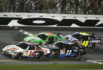DAYTONA BEACH, FL - JULY 04:  Tony Stewart, driver of the #14 Burger King Chevrolet races with Denny Hamlin, driver of the #11 FedEx Office Toyota, Kyle Busch, driver of the #18 Interstate Batteries Toyota and Jimmie Johnson, driver of the #48 Lowe's / Kobalt Tools Chevroletduring the NASCAR Sprint Cup Series 51st Annual Coke Zero 400 at Daytona International Speedway on July 4, 2009 in Daytona Beach, Florida.  (Photo by Jerry Markland/Getty Images for NASCAR)