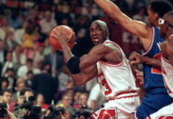19 May 1992:   Michael Jordan #23 of the Chicago Bulls looks to pass the ball during the game against the Cleveland Cavaliers at the United Center in Chicago, Illinois.  Michael Jordan #23 recieved a MVP trophy during a ceremony.    NOTE TO USER: It is expressly understood that the only rights Allsport are offering to license in this Photograph are one-time, non-exclusive editorial rights. No advertising or commercial uses of any kind may be made of Allsport photos. User acknowledges that it is aware that Allsport is an editorial sports agency and that NO RELEASES OF ANY TYPE ARE OBTAINED from the subjects contained in the photographs.Mandatory Credit: Jonathan Daniel  /Allsport