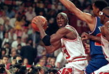 19 May 1992:   Michael Jordan #23 of the Chicago Bulls looks to pass the ball during the game against the Cleveland Cavaliers at the United Center in Chicago, Illinois.  Michael Jordan #23 recieved a MVP trophy during a ceremony.    NOTE TO USER: It is expressly understood that the only rights Allsport are offering to license in this Photograph are one-time, non-exclusive editorial rights. No advertising or commercial uses of any kind may be made of Allsport photos. User acknowledges that it is aware that Allsport is an editorial sports agency and that NO RELEASES OF ANY TYPE ARE OBTAINED from the subjects contained in the photographs.Mandatory Credit: Jonathan Daniel  /Allsport