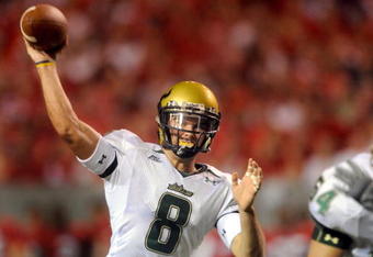 RALEIGH, NC - SEPTEMBER 27:  Quarterback Matt Grothe #8 of the South Florida Bulls throws a pass in the first quarter of the college football game against the North Carolina State Wolfpack at Carter-Finley Stadium on September 27, 2008 in Raleigh, North Carolina. (Photo by Steve Dykes/Getty Images)