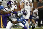 DETROIT - DECEMBER 10:  Travis Taylor #89 of the Minnesota Vikings is tackled by Daniel Bullocks #27 of the Detroit Lions on December 10, 2006 at Ford Field in Detroit, Michigan. The Vikings defeated the Lions 30-20.  (Photo by Gregory Shamus/Getty Images)