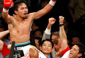 LAS VEGAS - MAY 02:  Manny Pacquiao of the Philippines celebrates after knocking out Ricky Hatton of England in the second round of their junior welterweight title fight at the MGM Grand Garden Arena May 2, 2009 in Las Vegas, Nevada.  (Photo by Ethan Miller/Getty Images)