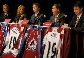 ENGLEWOOD, CO - JULY 09:  Joe Sakic (C) addresses the media as he announces his retirement during a press conference at the Inverness Hotel on July 9, 2009 in Englewood, Colorado. (L-R) are Don Baizley, Debbie Sakic, Joe Sakic, Pierre Lacroix and Greg Sherman. Sakic played 20 years in the NHL with the same organization, the Quebec Nordiques from 1988-1995 and the Colorado Avalanche from 1995 to 2009.  (Photo by Doug Pensinger/Getty Images)