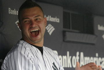 NEW YORK - JULY 2:  Nick Swisher #33 of the New York Yankees sits in the dugout before a game against the Seattle Mariners at Yankee Stadium on July 2, 2009 in the Bronx borough of New York City.  (Photo by Nick Laham/Getty Images)