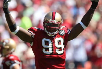 SAN FRANCISCO - SEPTEMBER 7:  Manny Lawson #99 of the San Francisco 49ers raises his arms during the game against the Arizona Cardinals on September 7, 2008 at Bill Walsh Field at Candlestick Park in San Francisco, California. (Photo by Jed Jacobsohn/Getty Images)