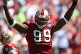 SAN FRANCISCO - SEPTEMBER 7:  Manny Lawson #99 of the San Francisco 49ers raises his arms during the game against the Arizona Cardinals on September 7, 2008 at Bill Walsh Field at Candlestick Park in San Francisco, California. (Photo by Jed Jacobsohn/Getty Images)