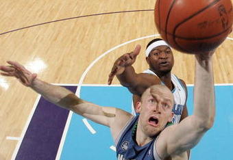 NEW ORLEANS - FEBRUARY 08:  Brian Cardinal #14 of the Minnesota Timberwolves  grabs a shot over Devin Brown #23 of the New Orleans Hornets on February 8, 2009 in New Orleans, Louisiana.  NOTE TO USER: User expressly acknowledges and agrees that, by downloading and/or using this Photograph, user is consenting to the terms and conditions of the Getty Images License Agreement.  (Photo by Chris Graythen/Getty Images)