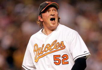 BALTIMORE - JUNE 28:  Winning pitcher B.J. Ryan #52 of the Baltimore Orioles reacts after striking out Derek Jeter #2 of the New York Yankees to end the top of the 10th inning on June 28, 2005 at Oriole Park at Camden Yards in Baltimore, Maryland.  (Photo By Jamie Squire/Getty Images)
