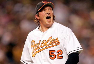 BALTIMORE - JUNE 28:  Winning pitcher B.J. Ryan #52 of the Baltimore Orioles reacts after striking out Derek Jeter #2 of the New York Yankees to end the top of the 10th inning on June 28, 2005 at Oriole Park at Camden Yards in Baltimore, Maryland.  (Photo By Jamie Squire/Getty Images)
