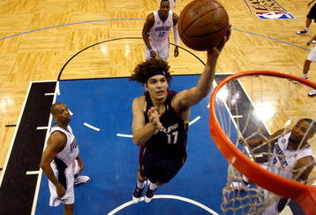 ORLANDO, FL - MAY 30:  Anderson Varejao #17 of the Cleveland Cavaliers drives to the hoop against Rafer Alston #1 and Rashard Lewis #9 of the Orlando Magic in Game Six of the Eastern Conference Finals during the 2009 Playoffs at Amway Arena on May 30, 2009 in Orlando, Florida. NOTE TO USER: User expressly acknowledges and agrees that, by downloading and or using this photograph, User is consenting to the terms and conditions of the Getty Images License Agreement  (Photo by Scott Audette-Pool/Getty Images)