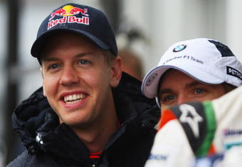 NURBURG, GERMANY - JULY 09:  Sebastian Vettel (L) of Germany and Red Bull Racing shares a joke with other German drivers in the paddock during previews to the German Formula One Grand Prix at Nurburgring on July 9, 2009 in Nurburg, Germany.  (Photo by Mark Thompson/Getty Images)