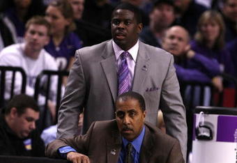 PORTLAND, OR - MARCH 21:  Head coach Lorenzo Romar of the Washington Huskies kneels down as assistant coach Cameron Dollar stands behind him in the second half against the Purdue Boilermakers during the second round of the NCAA Division I Men's Basketball Tournament at the Rose Garden on March 21, 2009 in Portland, Oregon.  (Photo by Jonathan Ferrey/Getty Images)