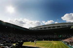WIMBLEDON, ENGLAND - JULY 05:  A general view of Centre Court as Roger Federer of Switzerland serves during the men's singles final match against Andy Roddick of USA on Day Thirteen of the Wimbledon Lawn Tennis Championships at the All England Lawn Tennis and Croquet Club on July 5, 2009 in London, England.  (Photo by Paul Gilham/Getty Images)