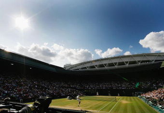 WIMBLEDON, ENGLAND - JULY 05:  A general view of Centre Court as Roger Federer of Switzerland serves during the men's singles final match against Andy Roddick of USA on Day Thirteen of the Wimbledon Lawn Tennis Championships at the All England Lawn Tennis and Croquet Club on July 5, 2009 in London, England.  (Photo by Paul Gilham/Getty Images)