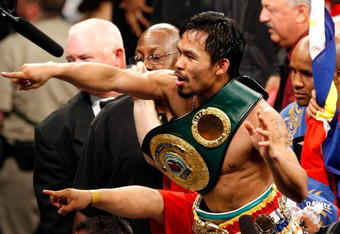 LAS VEGAS - MAY 02:  Manny Pacquiao of the Philippines celebrates after knocking out Ricky Hatton of England in the second round of their junior welterweight title fight at the MGM Grand Garden Arena May 2, 2009 in Las Vegas, Nevada.  (Photo by Ethan Miller/Getty Images)
