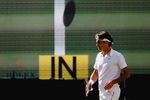 WIMBLEDON, ENGLAND - JULY 05:  Roger Federer of Switzerland looks on as hawkeye makes a call during the men's singles final match against Andy Roddick of USA on Day Thirteen of the Wimbledon Lawn Tennis Championships at the All England Lawn Tennis and Croquet Club on July 5, 2009 in London, England.  (Photo by Paul Gilham/Getty Images)