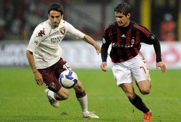 MILAN, ITALY - APRIL 19:  Pato of Milan (R) and Paolo Dellafiore of Torino in action during the Serie A match between Milan and Torino at the Stadio Meazza on April 19, 2009 in Milan, Italy. (Photo by New Press/Getty Images)