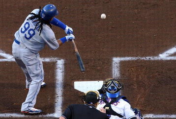 NEW YORK - JULY 09:  Manny Ramirez #99 of the Los Angeles Dodgers connects on a first inning RBI single against the New York Mets on July 9, 2009 at Citi Field in the Flushing neighborhood of the Queens borough of New York City.  (Photo by Jim McIsaac/Getty Images)