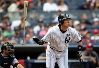 NEW YORK - JULY 04: Hideki Matsui #55 of the New York Yankees hits a solo home run against the Toronto Blue Jays on July 4, 2009 at Yankee Stadium in the Bronx borough of New York City.  (Photo by Nick Laham/Getty Images)