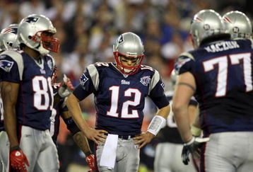 GLENDALE, AZ - FEBRUARY 03:  Tom Brady #12 of the New England Patriots huddles with his team during Super Bowl XLII against the New York Giants on February 3, 2008 at the University of Phoenix Stadium in Glendale, Arizona.  (Photo by Donald Miralle/Getty Images)