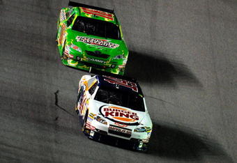 DAYTONA BEACH, FL - JULY 04: Tony Stewart, driver of the #14 Burger King Chevrolet, leads Kyle Busch, driver of the #18 Interstate Batteries Toyota, during the NASCAR Sprint Cup Series 51st Annual Coke Zero 400 at Daytona International Speedway on July 4, 2009 in Daytona Beach, Florida.  (Photo by Sam Greenwood/Getty Images)