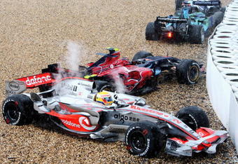 NURBURG, GERMANY - JULY 22:  (Bottom-Top) Lewis Hamilton of Great Britain and McLaren Mercedes, Scott Speed of United States and Scuderia Toro Rosso and Jenson Button of Great Britain and Honda Racing slide in the gravel after spinning of the track during the European Grand Prix at Nurburgring on July 22, 2007 in Nurburg, Germany.  (Photo by Mark Thompson/Getty Images)