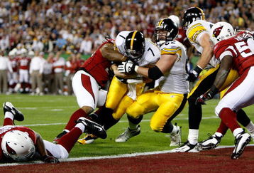 TAMPA, FL - FEBRUARY 01:  Quarterback Ben Roethlisberger #7 of the Pittsburgh Steelers dives into the endzone for a touchdown in the first quarter but the play was ruled no touchdown on a coaches' challenge against the Arizona Cardinals during Super Bowl XLIII on February 1, 2009 at Raymond James Stadium in Tampa, Florida.  (Photo by Streeter Lecka/Getty Images)