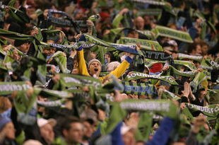 SEATTLE - MARCH 28:  Seattle Sounders fans celebrate their second goal by forward Fredy Montero against Real Salt Lake on March 28, 2009 at Qwest Field in Seattle, Washington. The Sounders defeated Real Salt Lake 2-0. (Photo by Otto Greule Jr/Getty Images)