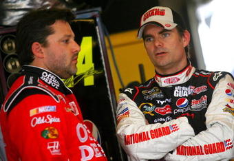 JOLIET, IL - JULY 09:  Jeff Gordon (R), driver of the #24 DuPont/National Guard Patriot Academy Chevrolet, speaks with Tony Stewart (L), driver of the #14 Office Depot/Old Spice Chevrolet, during practice for the NASCAR Sprint Cup Series LifeLock.com 400 at Chicagoland Speedway on July 9, 2009 in Joliet, Illinois.  (Photo by Jason Smith/Getty Images for NASCAR)