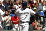 MILWAUKEE - MAY 14: Bill Hall #2 of the Milwaukee Brewers is congratulated by teammate Mike Cameron #25 after hitting his 100th career home run in the 2nd inning against the Florida Marlins on May 14, 2009 at Miller Park in Milwaukee, Wisconsin. The Brewers defeated the Marlins 5-3. (Photo by Jonathan Daniel/Getty Images)