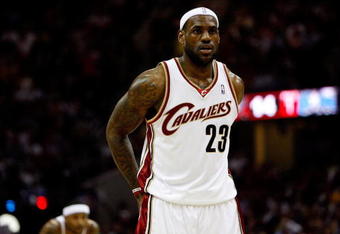 CLEVELAND - MAY 28:  LeBron James #23 of the Cleveland Cavaliers looks on between plays against the Orlando Magic in Game Five of the Eastern Conference Finals during the 2009 Playoffs at Quicken Loans Arena on May 28, 2009 in Cleveland, Ohio. NOTE TO USER: User expressly acknowledges and agrees that, by downloading and or using this photograph, User is consenting to the terms and conditions of the Getty Images License Agreement  (Photo by Gregory Shamus/Getty Images)