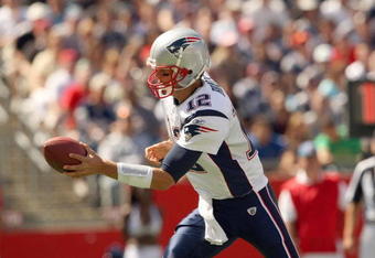 FOXBORO, MA - SEPTEMBER 7:  Quarterback Tom Brady #12 of the New England Patriots looks to hand off the ball during their NFL game against the Kansas City Chiefs on September 7, 2008 at Gillette Stadium in Foxboro, Massachusetts. The Patriots defeated the Chiefs 17-10. (Photo by Elsa Garrison/Getty Images)