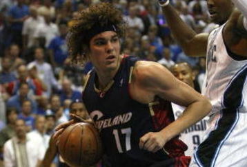 ORLANDO, FL - MAY 30:  Anderson Varejao #17 of the Cleveland Cavaliers handles the ball against Dwight Howard #12 of the Orlando Magic in Game Six of the Eastern Conference Finals during the 2009 Playoffs at Amway Arena on May 30, 2009 in Orlando, Florida. NOTE TO USER: User expressly acknowledges and agrees that, by downloading and or using this photograph, User is consenting to the terms and conditions of the Getty Images License Agreement  (Photo by Elsa/Getty Images)