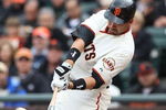 SAN FRANCISCO - APRIL 07:  Travis Ishikawa #10 of the San Francisco Giants hits a three run triple in the first inning against the Milwaukee Brewers during Opening Day of the Major League Baseball season on April 7, 2009 at AT&T Park in San Francisco, California.  (Photo by Jed Jacobsohn/Getty Images)