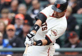 SAN FRANCISCO - APRIL 07:  Travis Ishikawa #10 of the San Francisco Giants hits a three run triple in the first inning against the Milwaukee Brewers during Opening Day of the Major League Baseball season on April 7, 2009 at AT&T Park in San Francisco, California.  (Photo by Jed Jacobsohn/Getty Images)