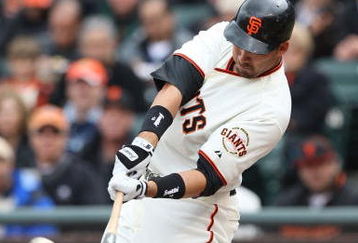 SAN FRANCISCO - APRIL 07:  Travis Ishikawa #10 of the San Francisco Giants hits a three run triple in the first inning against the Milwaukee Brewers during Opening Day of the Major League Baseball season on April 7, 2009 at AT&T Park in San Francisco, California.  (Photo by Jed Jacobsohn/Getty Images)