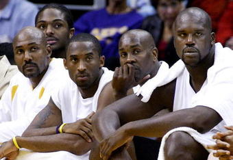 LOS ANGELES, CA - NOVEMBER 2: (L-R) Los Angeles Lakers players Karl Malone, Kobe Bryant, Gary Payton and Shaquille O'Neal watch from the bench during the game against the Golden State Warriors on November 2, 2003 at Staples Center in Los Angeles, California. The Lakers won 87-72.  (Photo by Vince Bucci/Getty Images) 