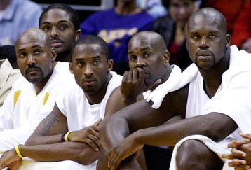 LOS ANGELES, CA - NOVEMBER 2: (L-R) Los Angeles Lakers players Karl Malone, Kobe Bryant, Gary Payton and Shaquille O'Neal watch from the bench during the game against the Golden State Warriors on November 2, 2003 at Staples Center in Los Angeles, California. The Lakers won 87-72.  (Photo by Vince Bucci/Getty Images) 