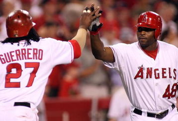 ANAHEIM, CA - AUGUST 12:  Vladimir Guerrero #27 of the Los Angeles Angels of Anaheim  is congratulated by Torii Hunter #48 after Guerrero hits a two-run home run in the fifth inning during a game against the Seattle Mariners at Angel Stadium on August 12, 2008 in Anaheim, California.  (Photo by Christian Petersen/Getty Images)