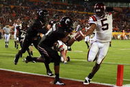 MIAMI - JANUARY 01: Tyrod Taylor #5 of the Virginia Tech Hokies runs the ball for a toucdown against Brandon Underwood #8 of the Cincinnati Bearcats during the FedEx Orange Bowl against at Dolphin Stadium on January 1, 2009 in Miami, Florida. (Photo by Doug Benc/Getty Images)