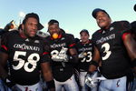 CINCINNATI, OH - NOVEMBER 29: Brandon Mills #58, Lynell Payne #82 and Delbert Ferguson #3 of the Cincinnati Bearcats celebrate with teammates after the game against the Syracuse Orange at Nippert Stadium on November 29, 2008 in Cincinnati, Ohio. The Bearcats defeated the Orange 30-10 to claim the Big East title and a spot in the Orange Bowl. (Photo by Joe Robbins/Getty Images)