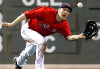 BOSTON - APRIL 24: Jason Bay #44 of the Boston Red Sox prepares to make a diving catch against the New York Yankees at Fenway Park, April 24, 2009, in Boston, Massachusetts. (Photo by Jim Rogash/Getty Images)
