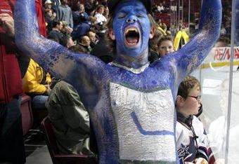 VANCOUVER, CANADA - JANUARY 11:  A fan shows off his painted body as he cheers prior to the start of the Vancouver Canucks and Minnesota Wild game at General Motors Place on January 11, 2007 in Vancouver, Canada.  (Photo by Jeff Vinnick/Getty Images)
