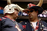 HOUSTON - OCTOBER 05: Houston Texans fans talk during the game against the Indianapolis Colts on October 5, 2008 at Reliant Stadium in Houston, Texas.  The Colts won 31-27.  (Photo by Stephen Dunn/Getty Images)