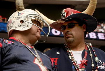 HOUSTON - OCTOBER 05: Houston Texans fans talk during the game against the Indianapolis Colts on October 5, 2008 at Reliant Stadium in Houston, Texas.  The Colts won 31-27.  (Photo by Stephen Dunn/Getty Images)