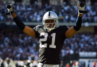 OAKLAND, CA - OCTOBER 02:  Nnamdi Asomugha #21 of the Oakland Raiders celebrates after stopping the Dallas Cowboys from scoring in the fourth quarter on October 2, 2005 at McAfee Coliseum in Oakland, California.  (Photo by Jonathan Ferrey/Getty Images)