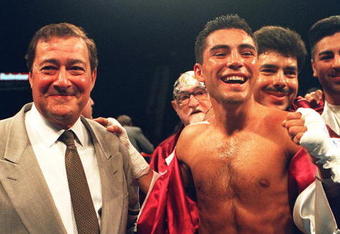 27 May 1994: Oscar De La Hoya Celebrates with promoter Bob Arum after retaining his WBO Junior Lightweight Belt against challenger Giorgio Campanella at the MGM Grand Hotel in Las Vegas.