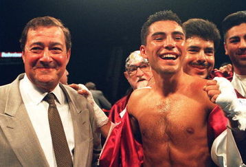 27 May 1994: Oscar De La Hoya Celebrates with promoter Bob Arum after retaining his WBO Junior Lightweight Belt against challenger Giorgio Campanella at the MGM Grand Hotel in Las Vegas.