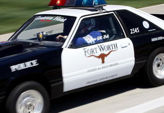 FORT WORTH, TX  MAY 29:  Fort Worth police officer J.R. Bell drag races down pit lane at Texas Motor Speedway to kickoff the new Scion Drag-n-Brag organized street racing series May 29, 2009 in Fort Worth, Texas. The series will feature racing in four different classes down a 1/8-mile drag strip along pit lane and a 'Show & Shine' program and will a season champion will be named August 7.  (Photo By Tom Pennington/Getty Images for the Texas Motor Speedway)